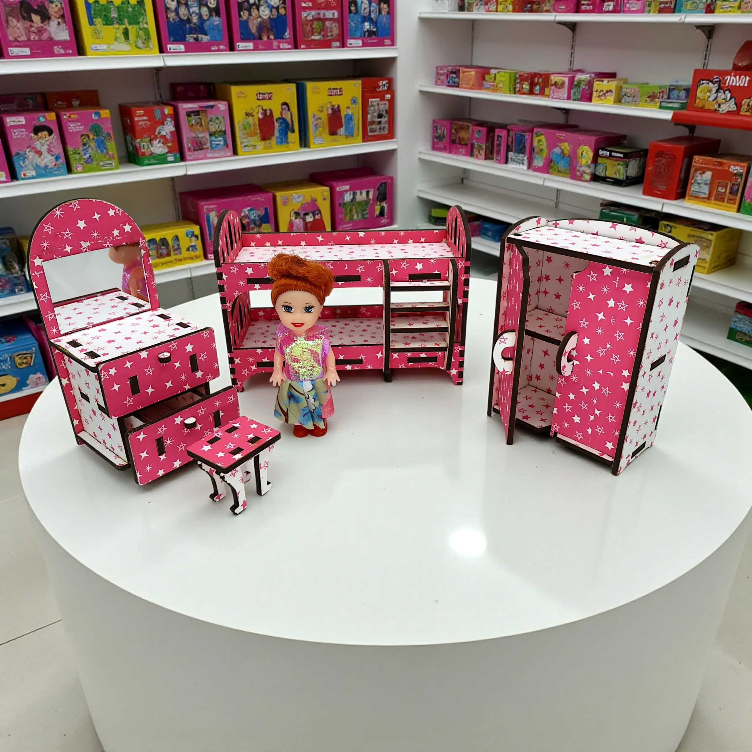 miniature bedroom scene set inside a dollhouse with furniture arranged for creative play