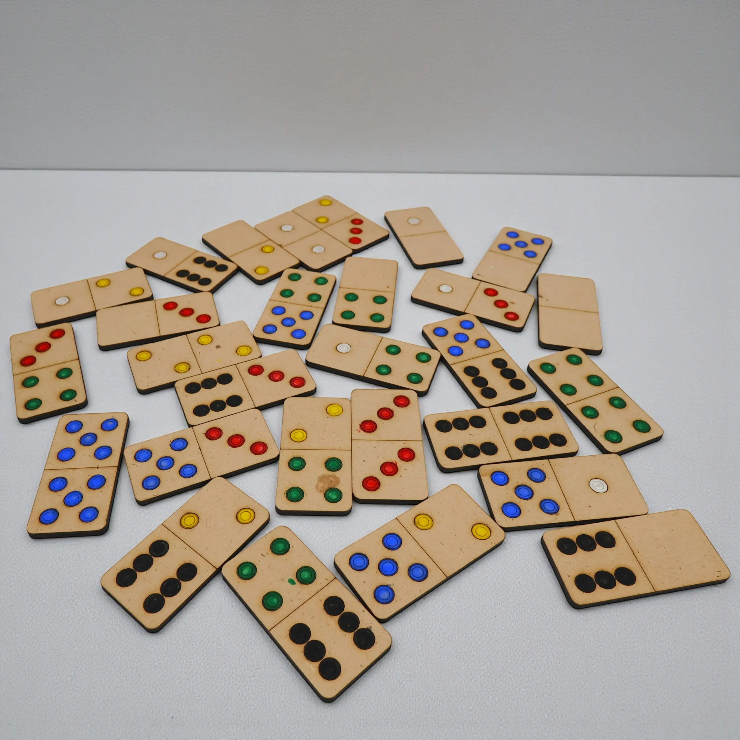 complete wooden domino set showing dot patterns for number matching