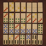 close up of wooden domino tiles with clear dot number markings