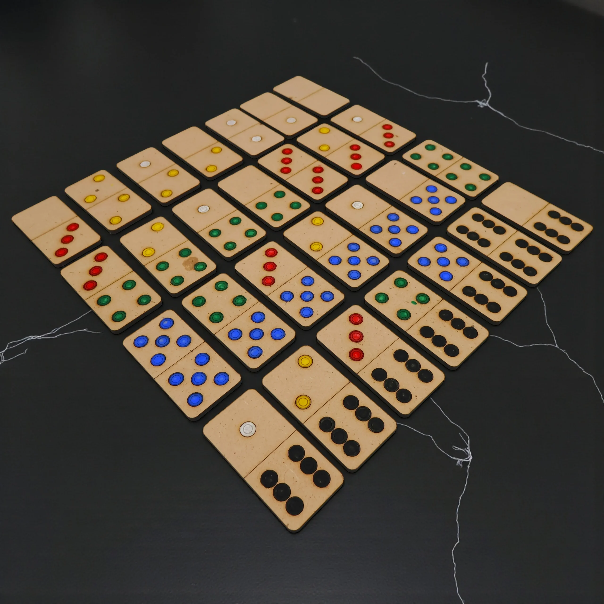 family playing wooden domino dot game together at home