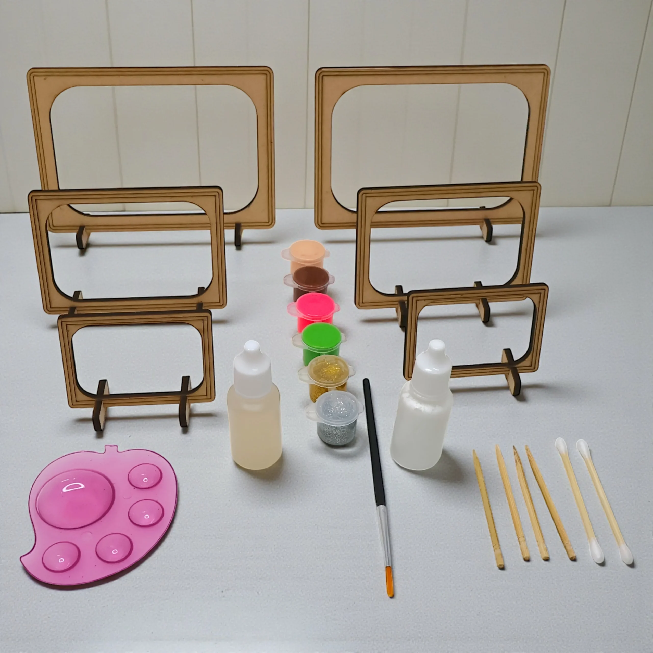 complete glass painting kit showing colors brushes and painting tools