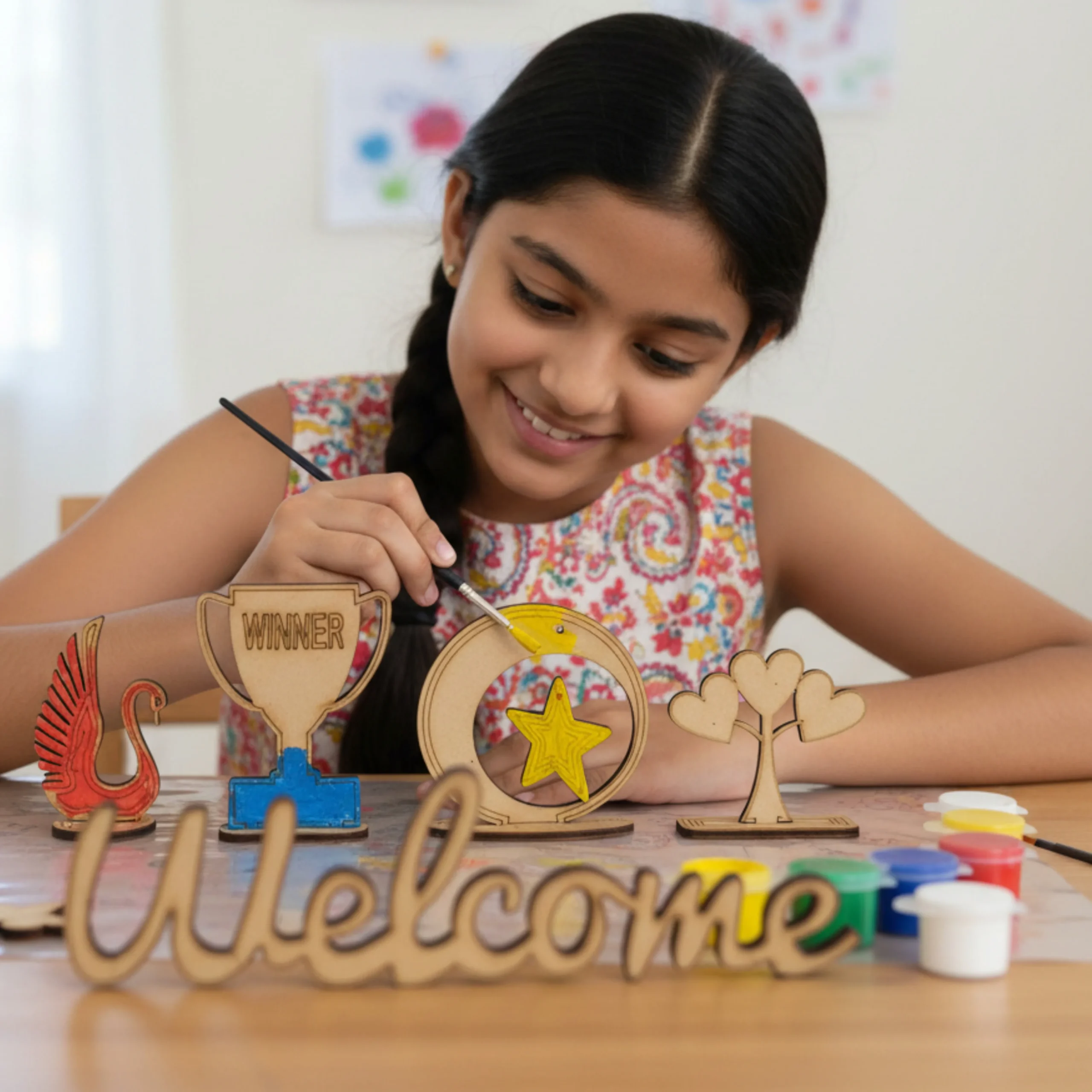 kids painting wooden shapes using wood painting kit