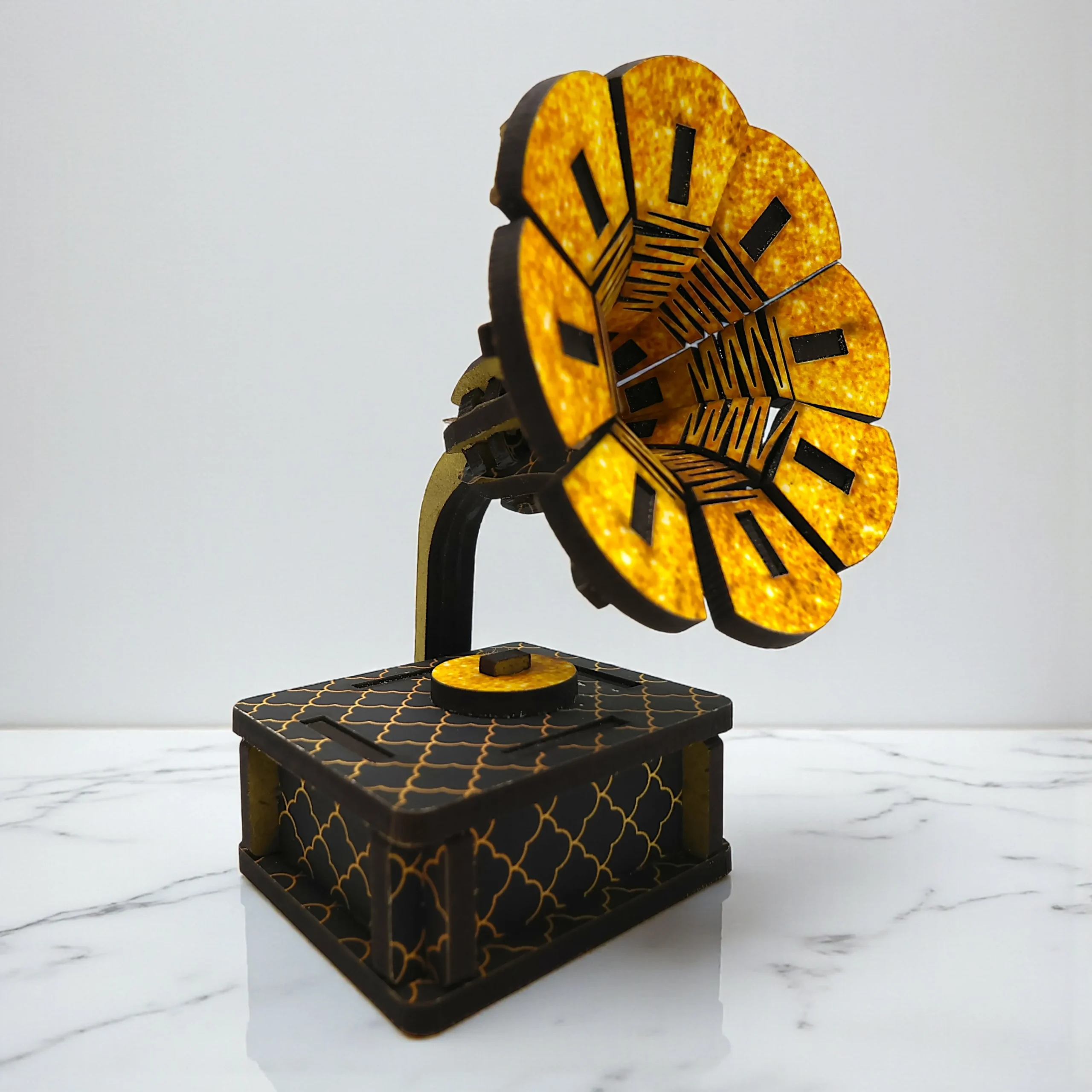 close up of miniature wooden gramophone décor piece with vintage-style horn design